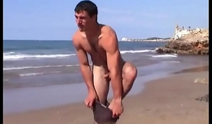 Naked beach  hunk goes rafting.